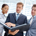 stock image of business professionals reviewing documents