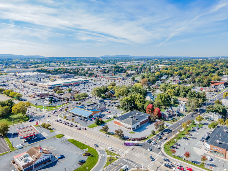 aerial view of a populated area with retail and restaurant businesses